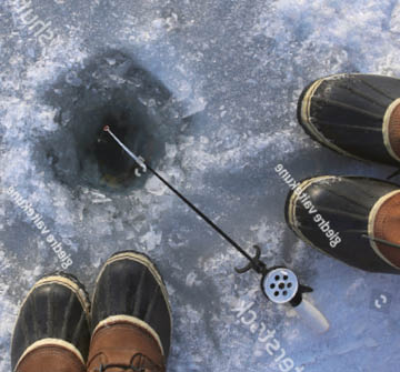 Ice fishing hole from a downwards perspective